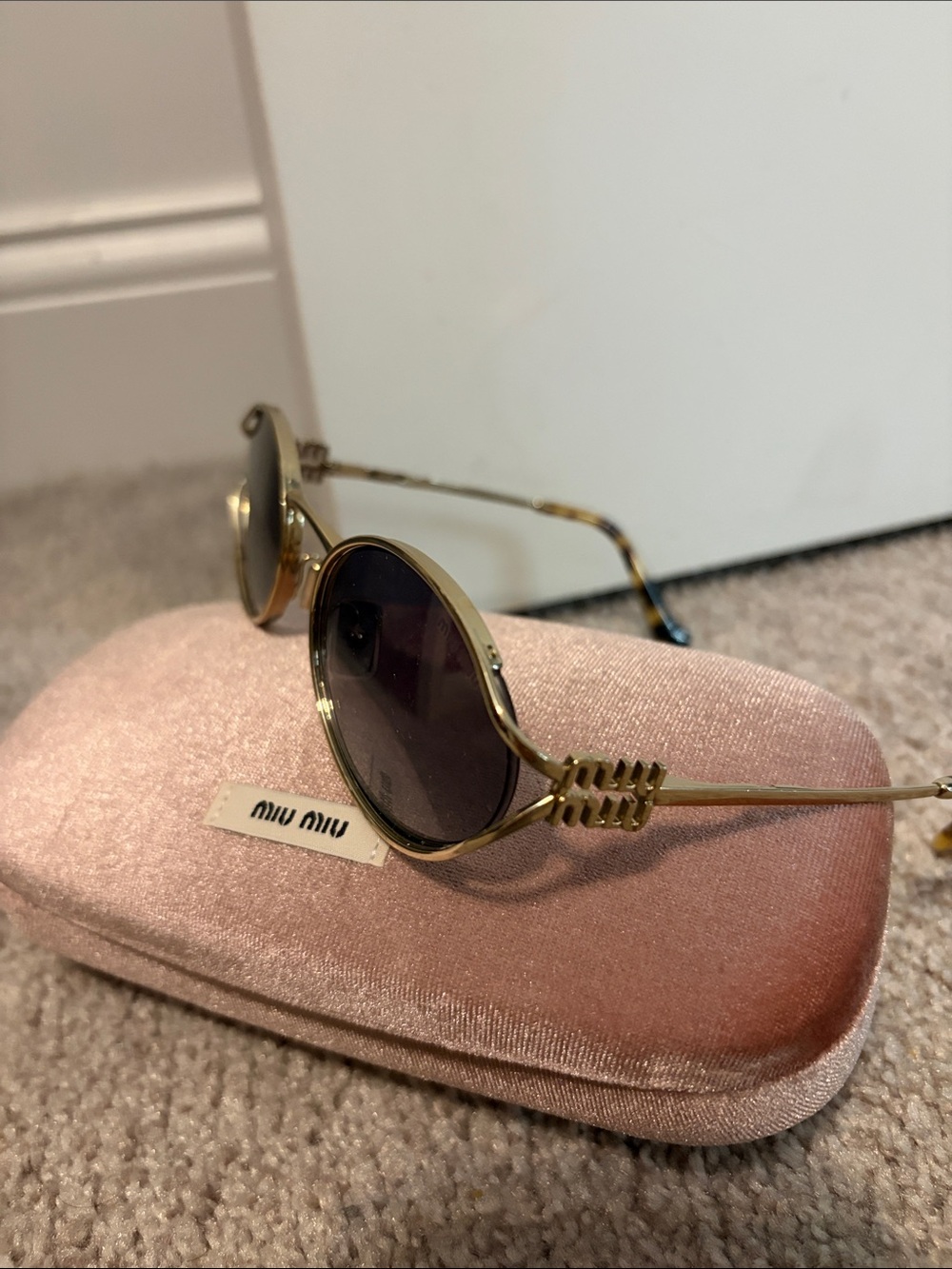 Miu Miu Oval Sunglasses